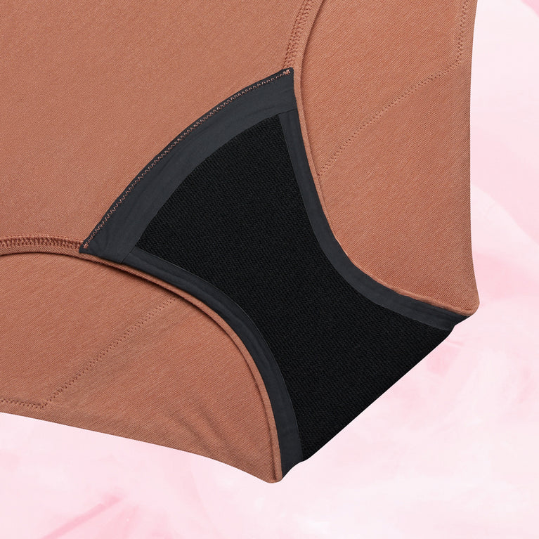 Culotte menstruelle Confort Premium High Waist Moderate, gros plan sur le tissu doux et discret avec technologie TriTech pour une protection jusqu'à 12 heures.