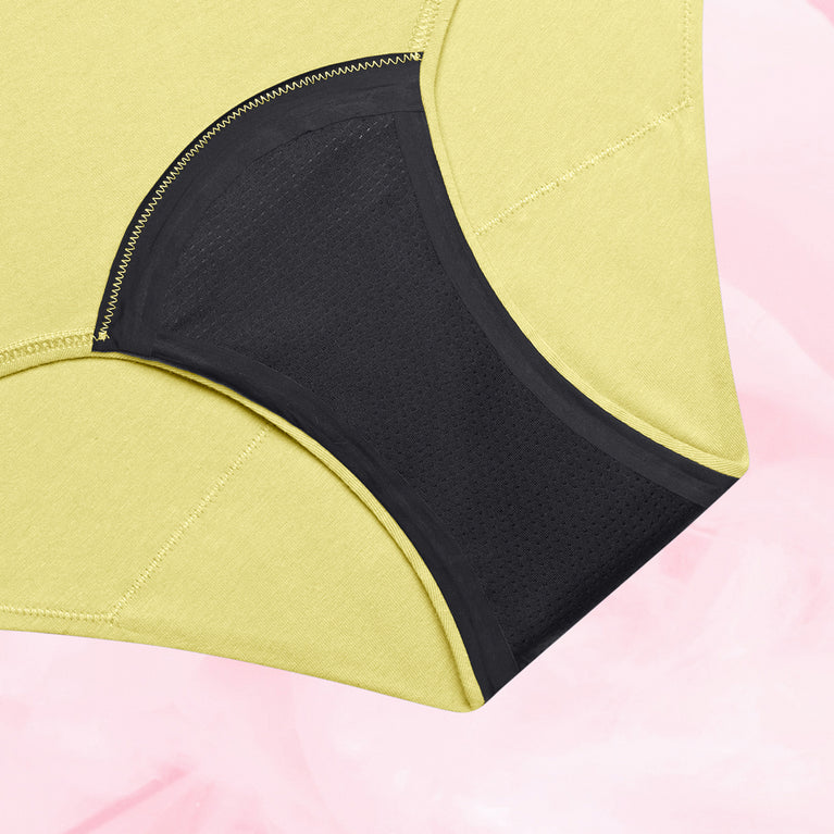 Culotte menstruelle ComfortFit Essentielle Hipster Heavy, design jaune et noir, offrant protection fiable avec technologie TriTech pour flux léger et confort optimal.