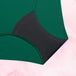 Culotte menstruelle ComfortFit Essentielle Hipster Light, tissu vert et noir, protection fiable, gousset ajusté, certifiée Oeko-TEX®, coupe hipster pour flux léger.