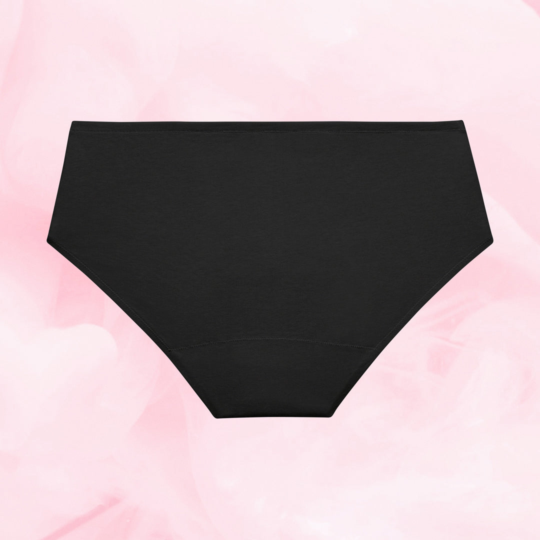 Culotte noire Pack Best-seller, haute, à plat sur fond rose.