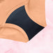 Culotte menstruelle Hipster Full Lace Heavy, gros plan sur tissu noir et orange, ceinture en dentelle élastiquée pour confort et absorption optimale.