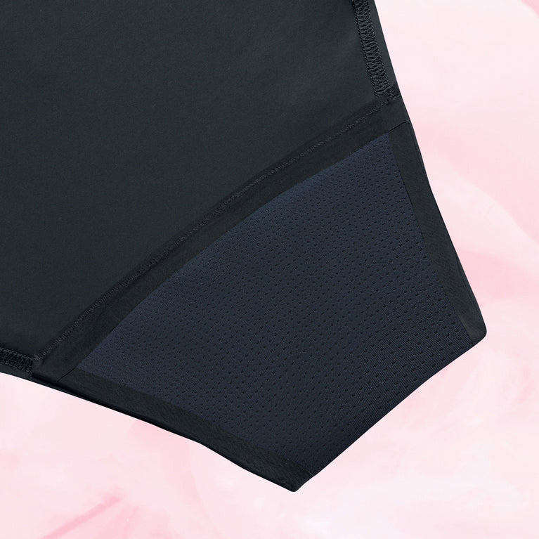Culotte menstruelle Brazilian Heavy, noire, avec ceinture en dentelle élastiquée, offrant 12 heures de protection pour flux abondant.